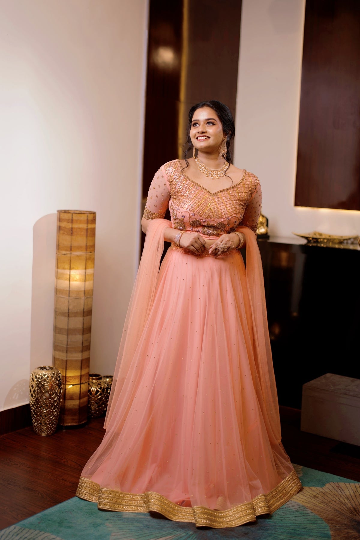 Peach Bridal Lehenga Detailed with Golden Zardozi & Sequence Work