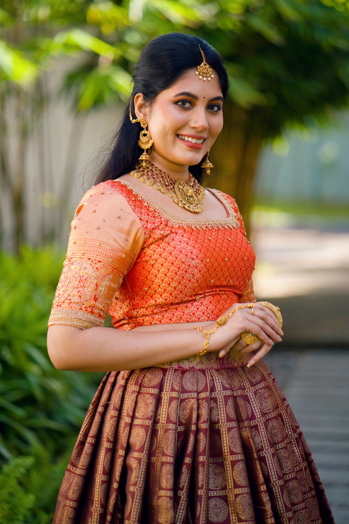 Fire Orange Traditional Lehenga detailed with Golden Highlight Embroidery
