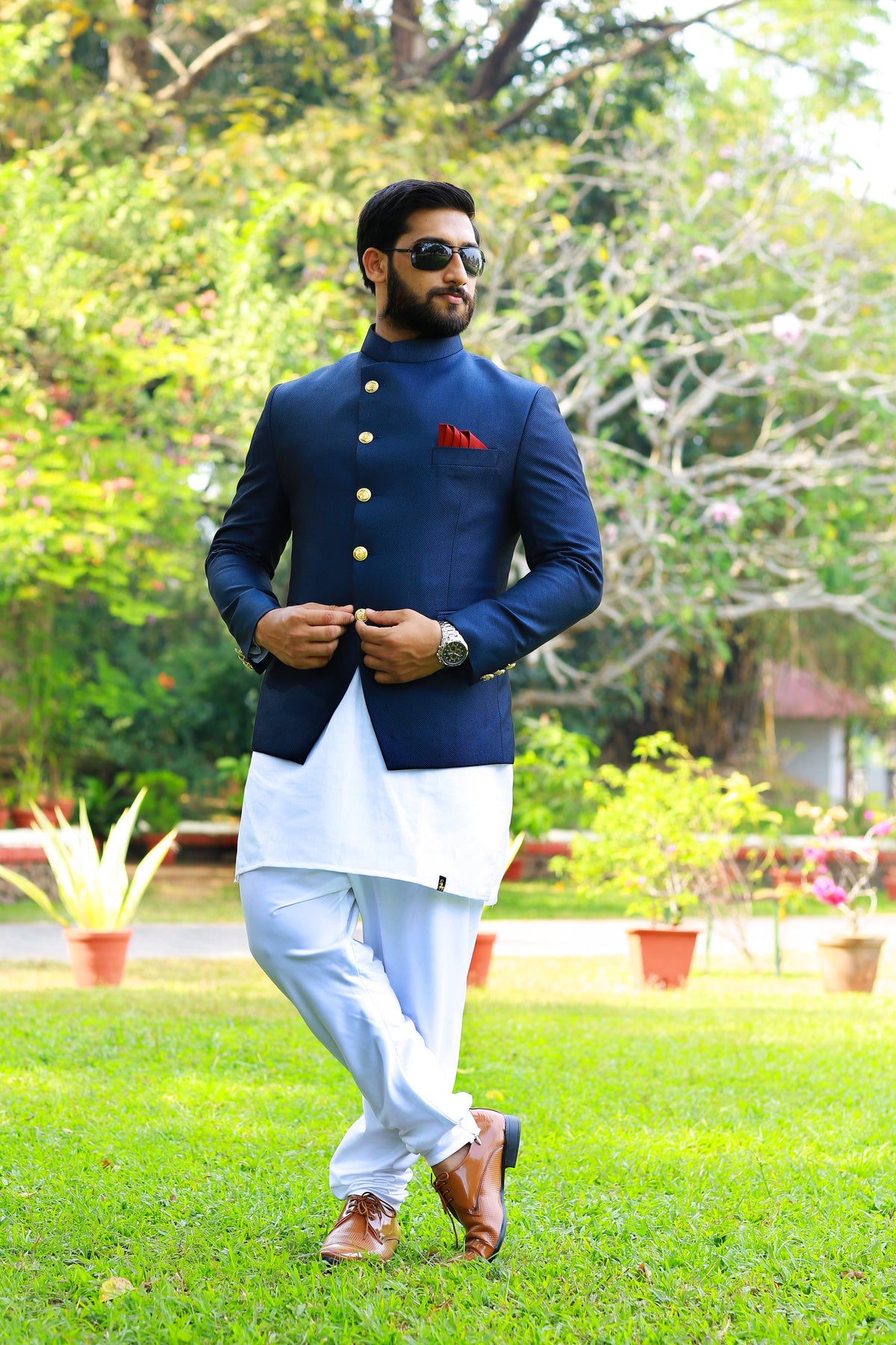 Midnight Blue Indo Western Bandhgala Suit With Thread Handwork Detailing paired with White Kurta & White Narrow Pants (Set of 3)