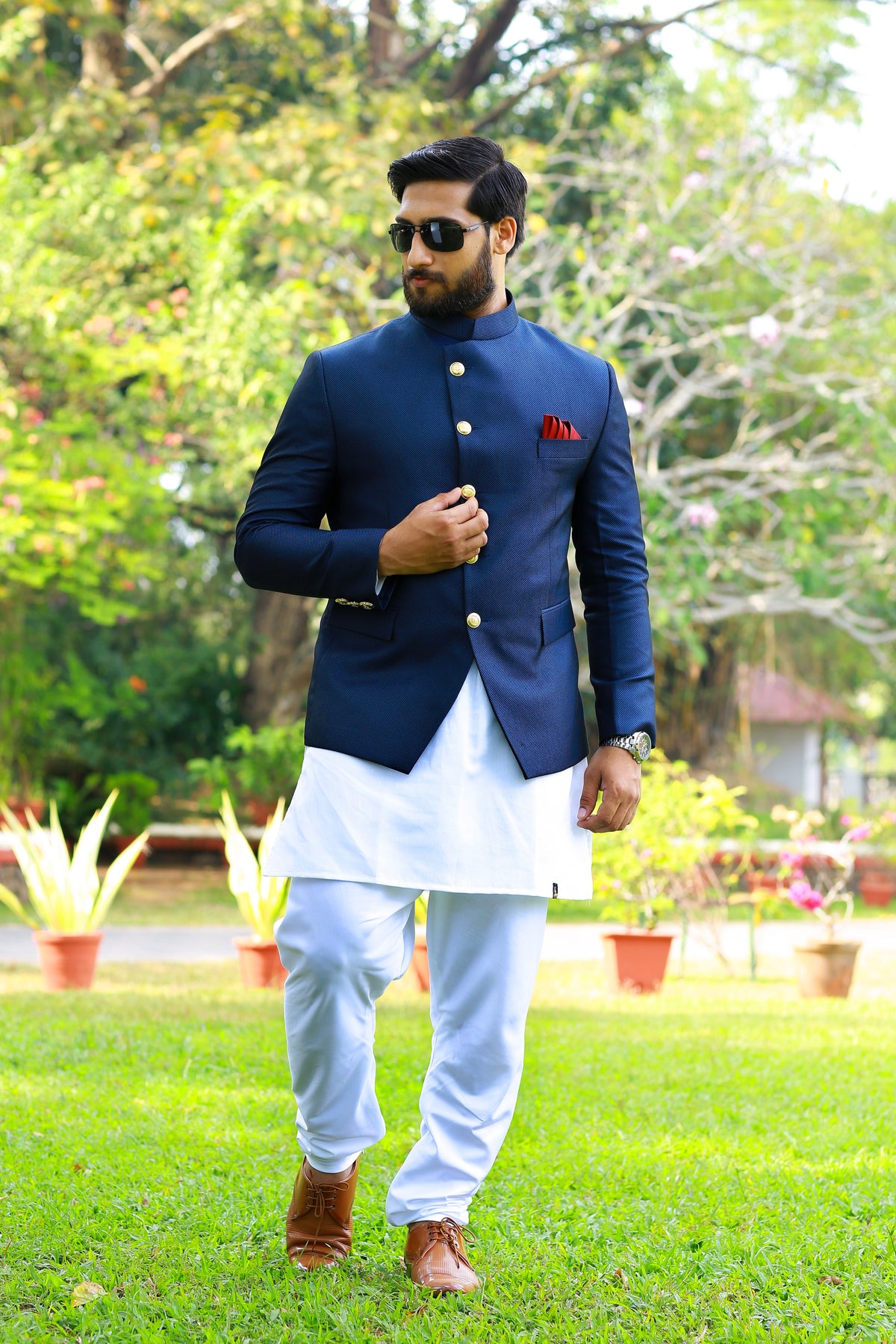 Midnight Blue Indo Western Bandhgala Suit With Thread Handwork Detailing paired with White Kurta & White Narrow Pants (Set of 3)
