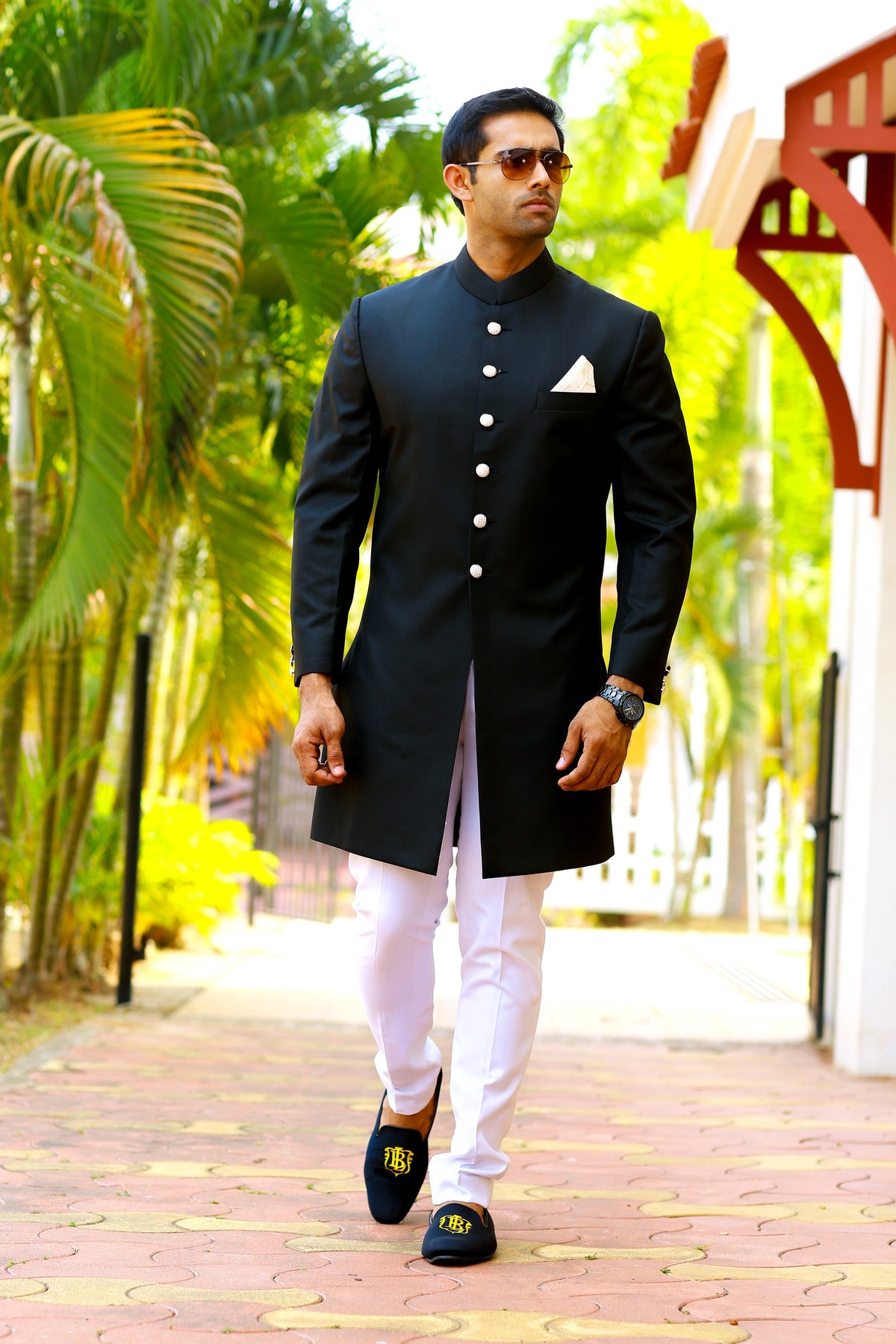 Jet Black Indo Western Slim Achkan Suit paired with White Narrow Pants (Set of 2)