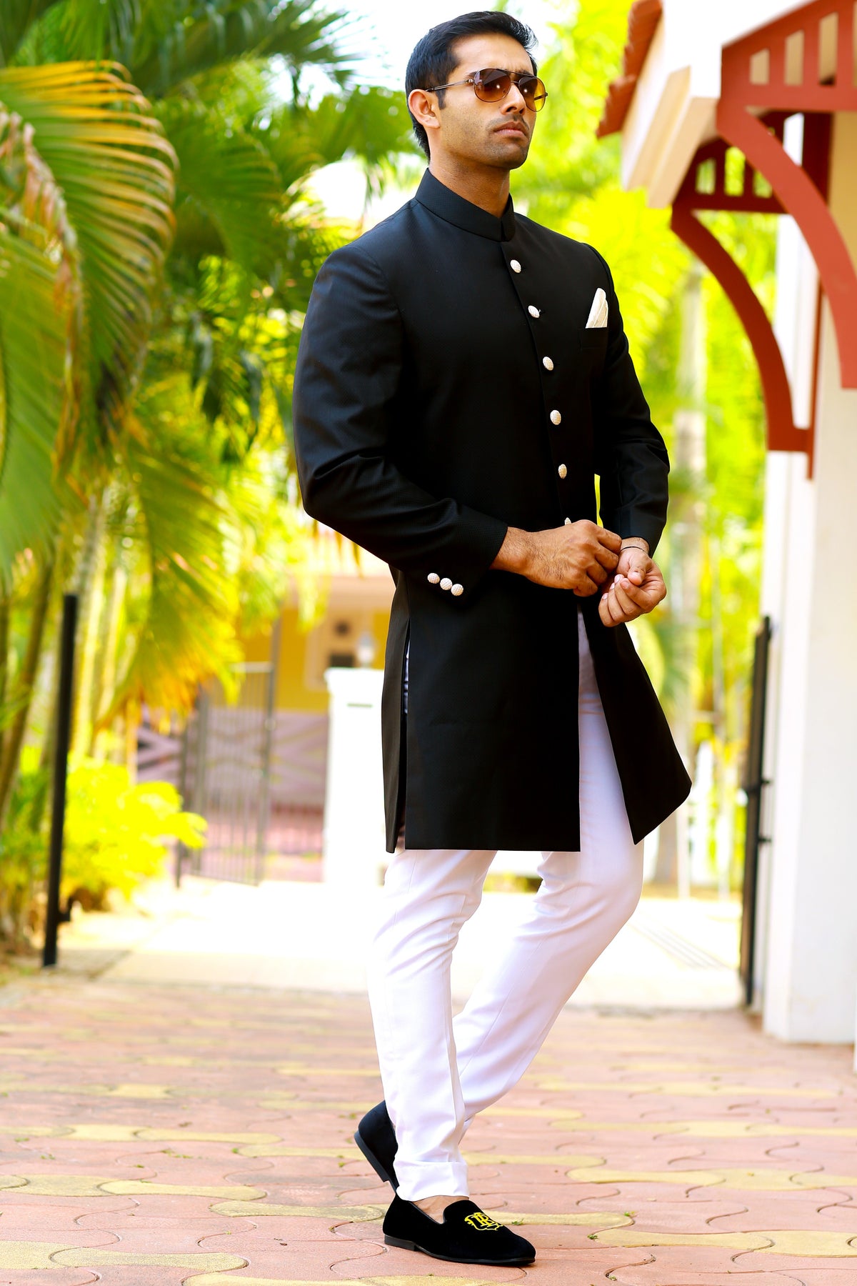 Jet Black Indo Western Slim Achkan Suit paired with White Narrow Pants (Set of 2)