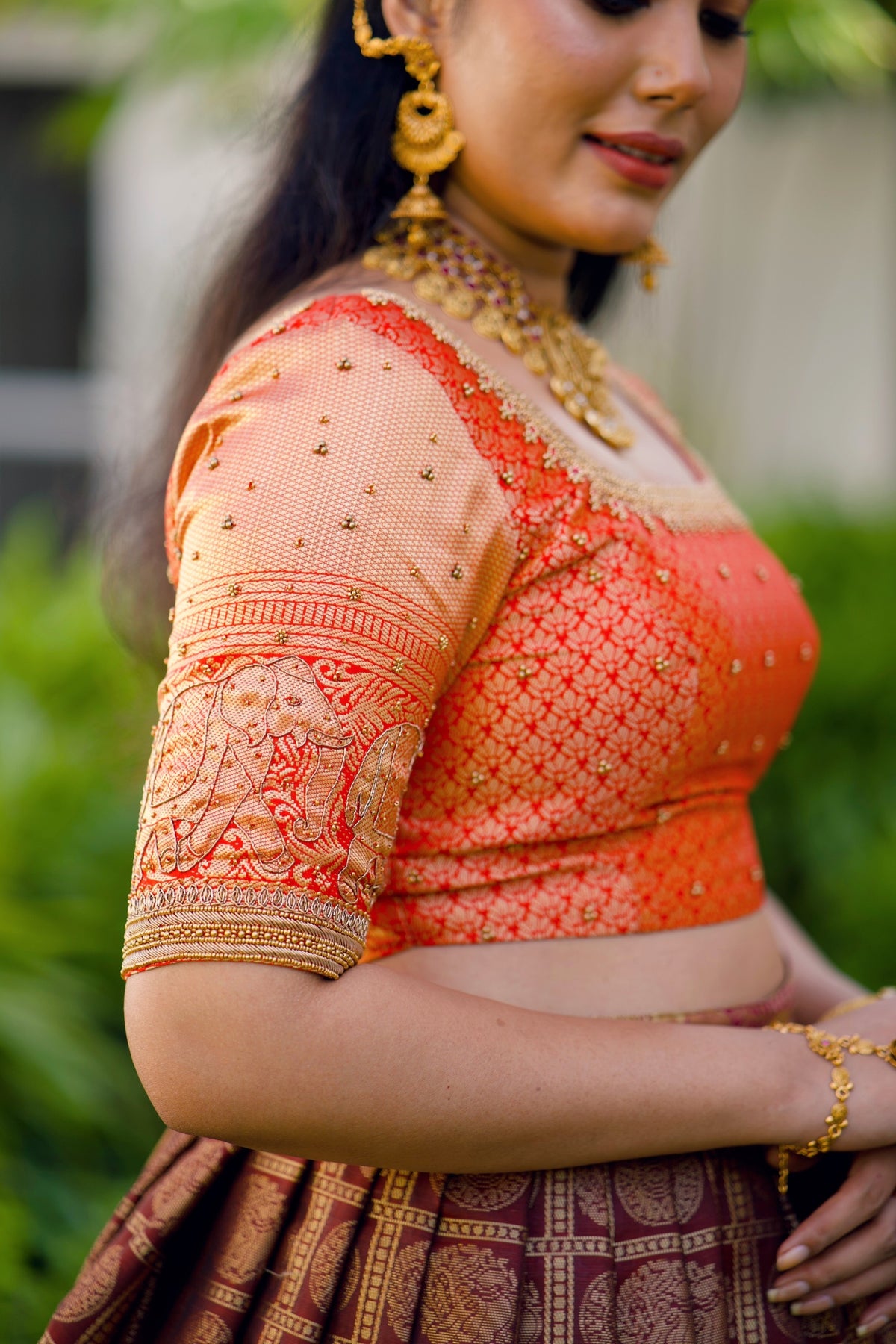 Fire Orange Traditional Lehenga detailed with Golden Highlight Embroidery