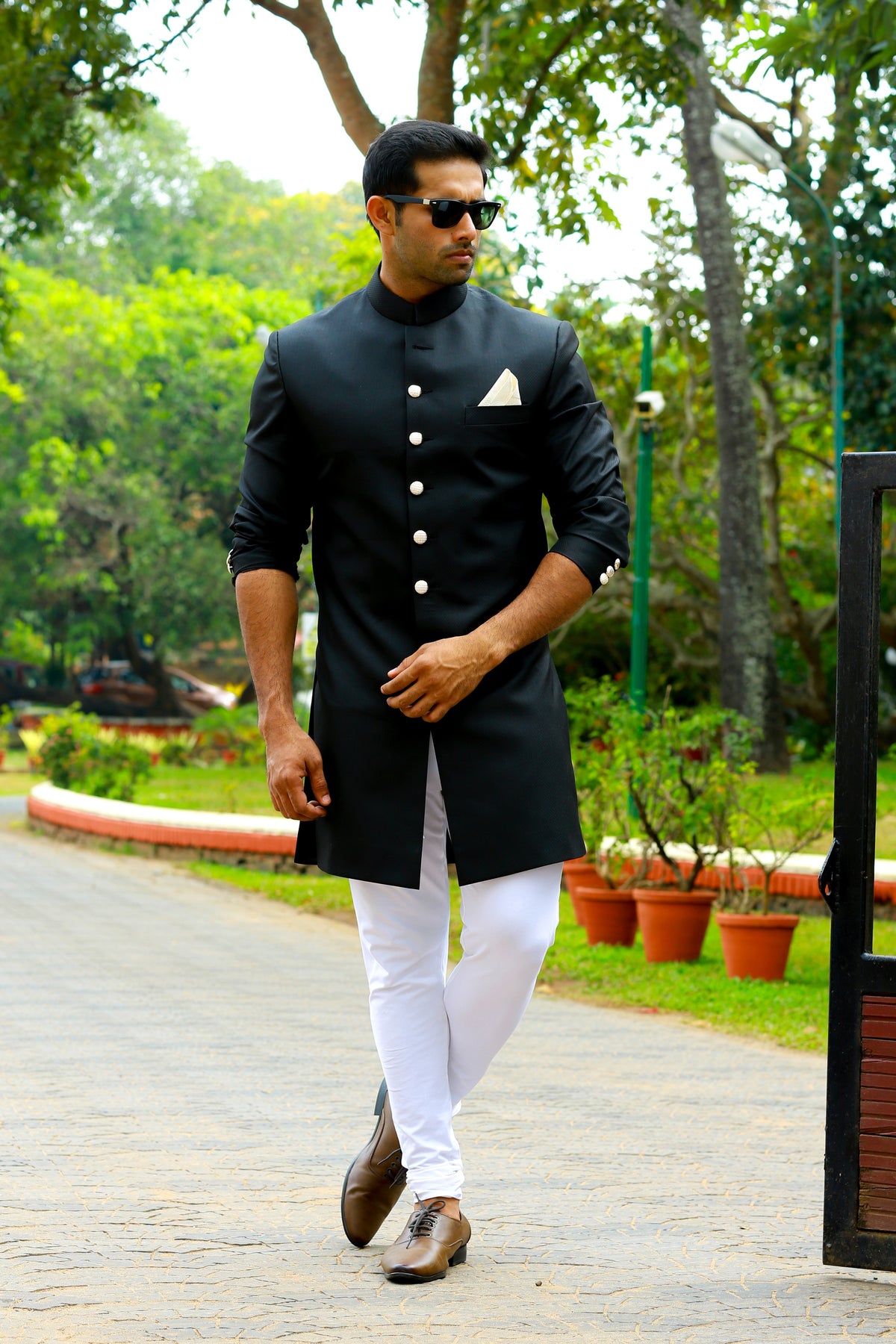 Jet Black Indo Western Slim Achkan Suit  paired with White Narrow Pants (Set of 2)